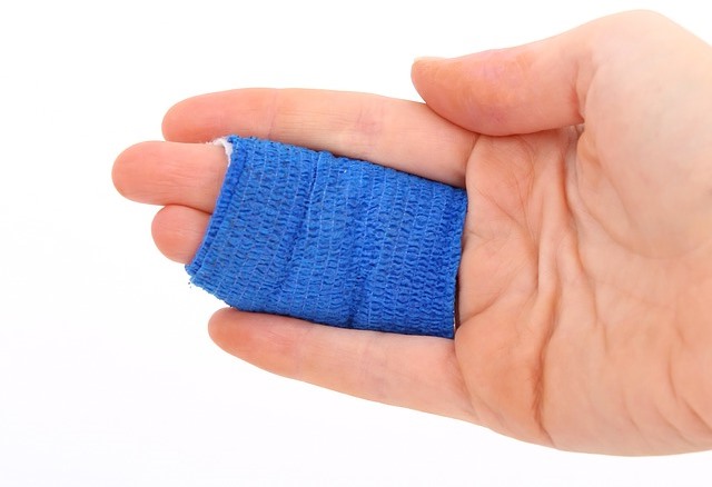 Hand with blue bondage