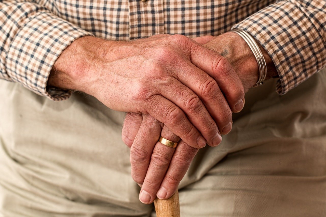 old man holding a walking stick